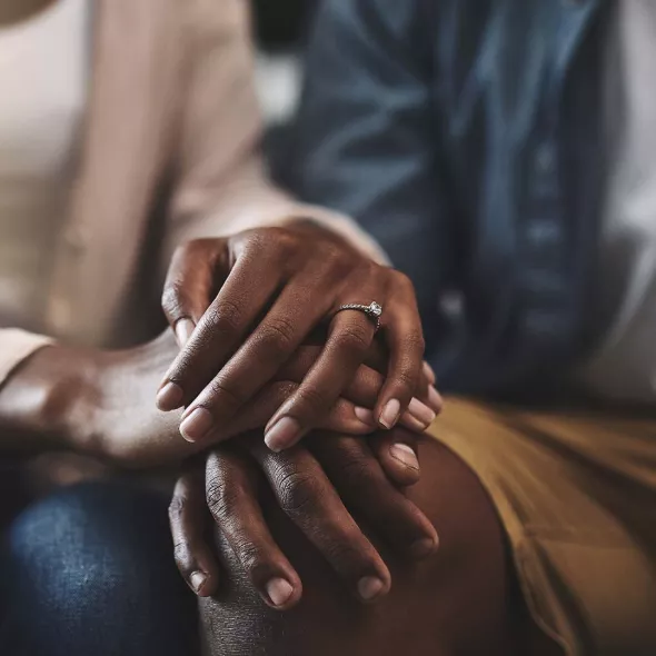 Close-up of Black Couple Holding Hands