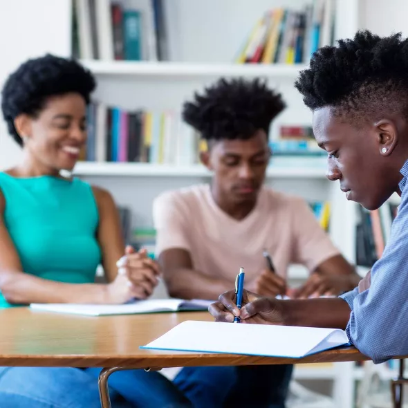 Black Students Doing Work at Desk