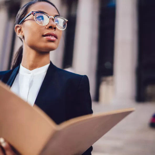 Black Female Professional Wearing Suit Outside Courthouse