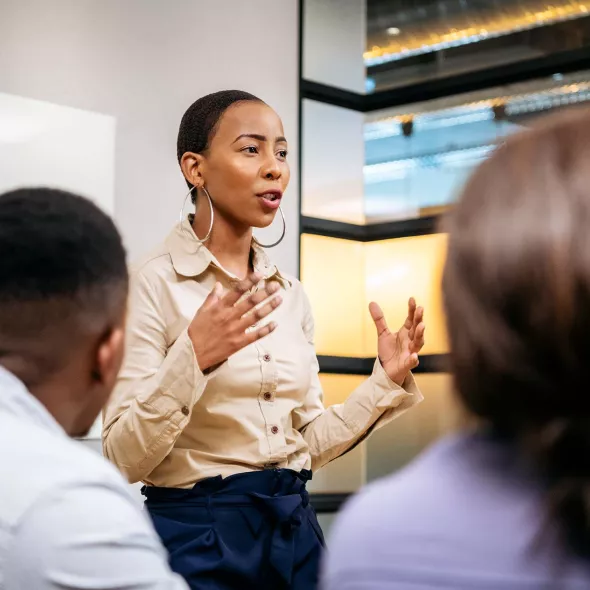 Black Female Leading Presentation in Meeting