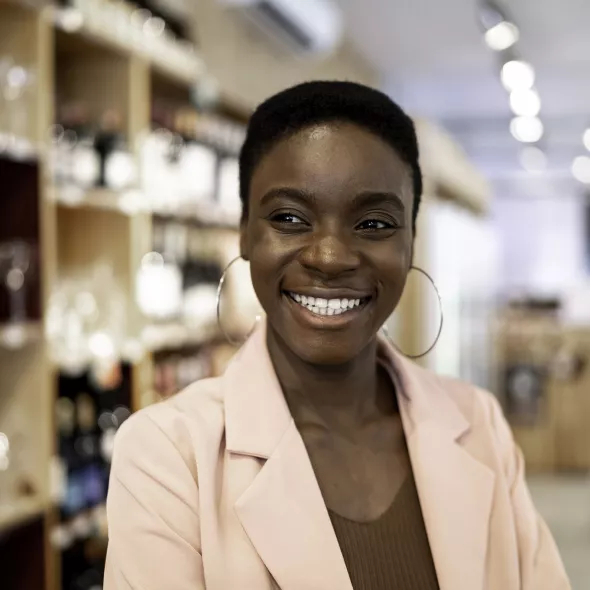 Close-up Shot of Smiling Woman Inside Store