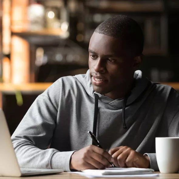 Young Black Male - Solo - at Laptop Studying