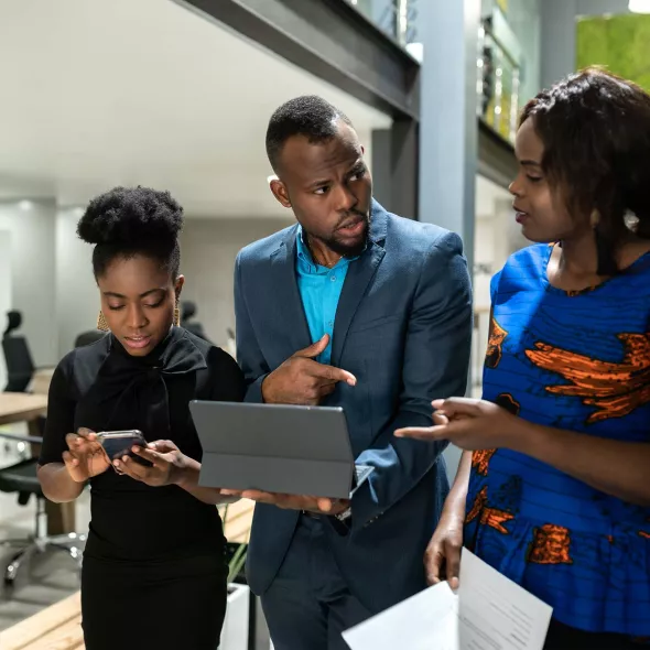 Black Male with two Black Females - Office Setting