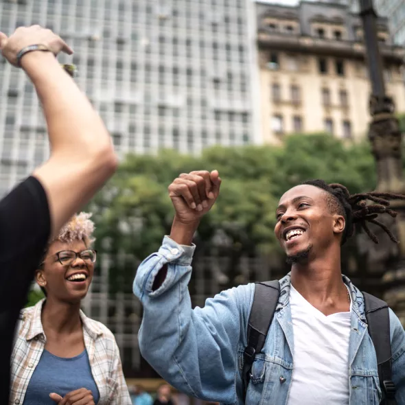 Group of Young People Having Fun and Dancing Together Outside