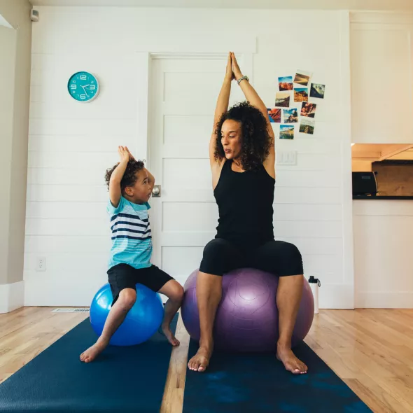 Mother and Child on Exercise Balls Inside Home