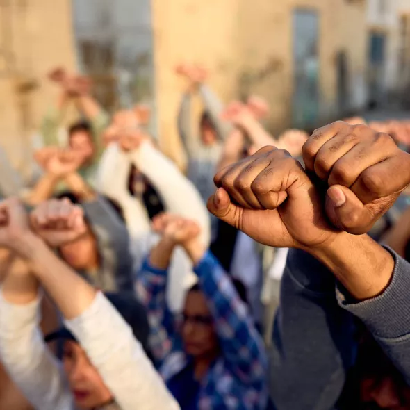 Group Holding Raised Fists in Protest