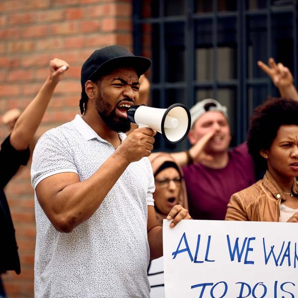 Black Man Protesting, Speaking into a Megaphone