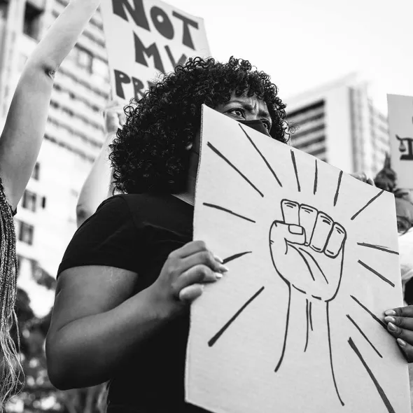 Group of Females Protesting - Holding Signs