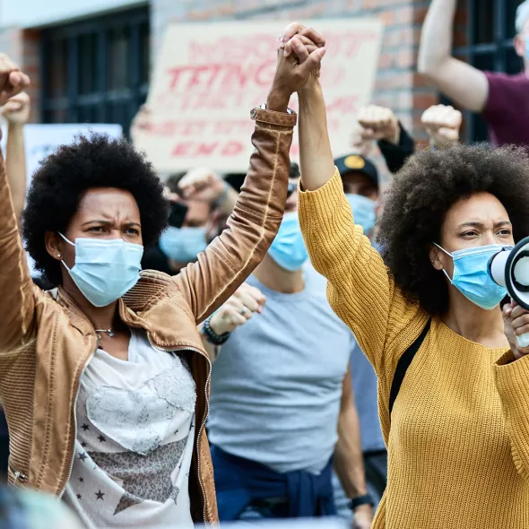 Black Females with Hands Locked in Protest