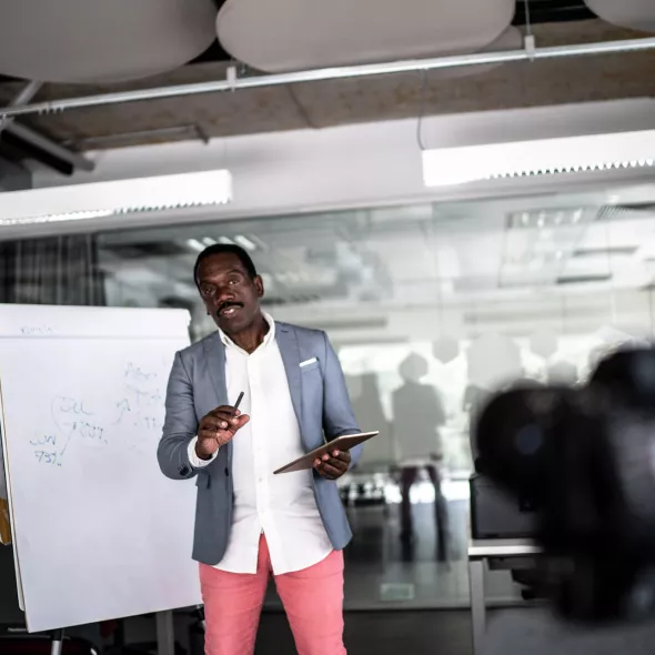 Black Businessman Giving a Presentation