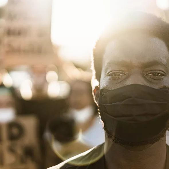 Black Male Standing with Protesters - Closeup