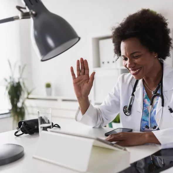 Black Doctor Having a Virtual Appointment - Indoors