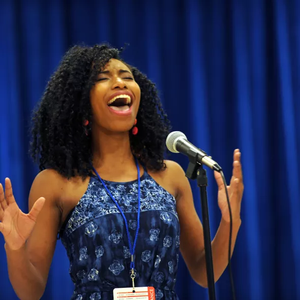 Girl singing in ACT-SO competition