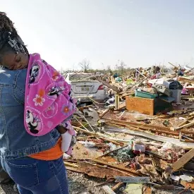 Woman holding Baby in Mississippi after tornado