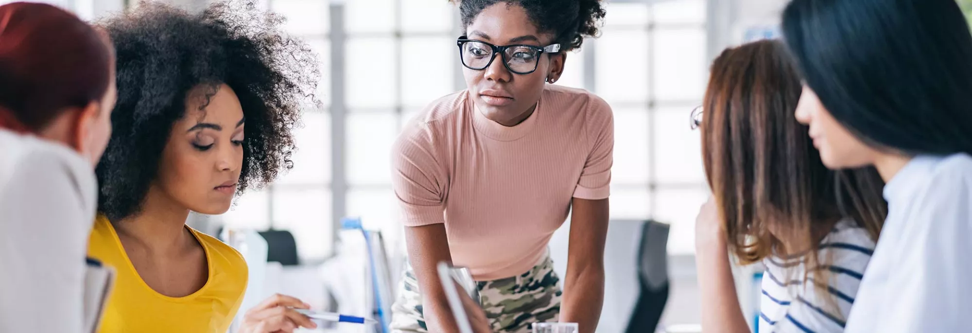 Young Black Female in Group - Collaborating - Office Setting