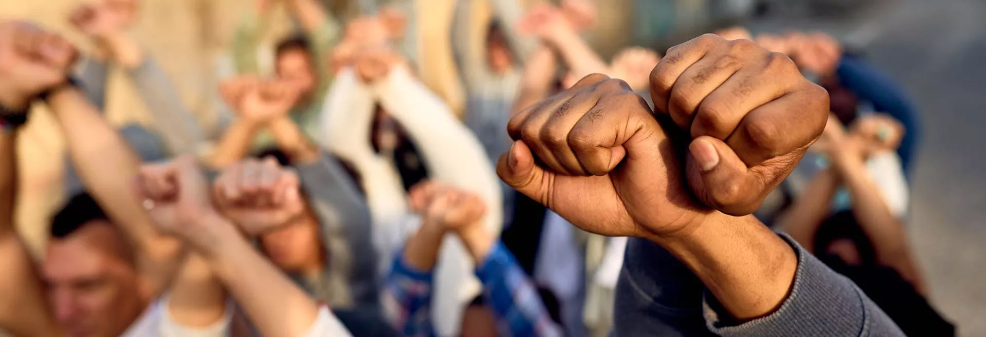 Group Holding Raised Fists in Protest