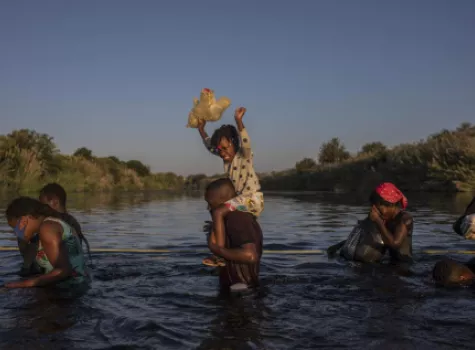 Haitians crossing the border