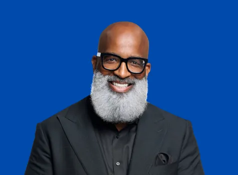 Headshot of Jason Wilson Smiling in Black Suit
