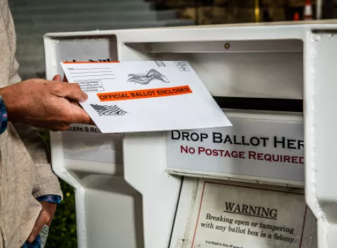 Black man voting by mail