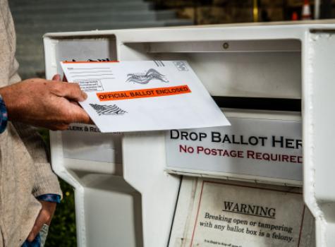 Black man voting by mail