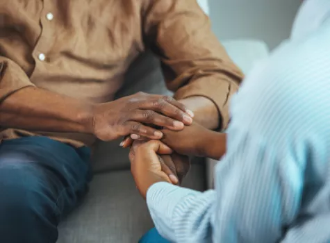 Two people holding hands.