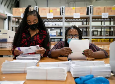 Black Female Election Workers - tallying election votes