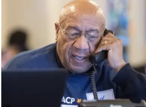 An NAACP volunteer calling voters