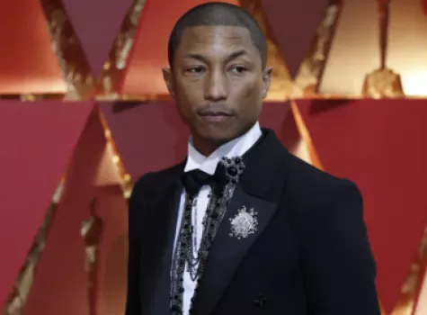 Pharrell Williams, seen at the 2017 Academy Awards, fully paid off five students’ student loan debt at an NAACP panel.(Allen J. Schaben / Los Angeles Times)