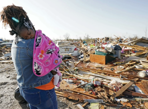 Woman holding Baby in Mississippi after tornado