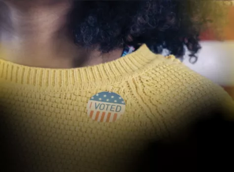 Black Voter Day Hero - Black woman wearing I Voted Sticker