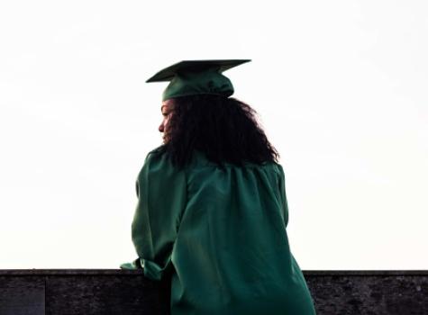 Young Black Female - Outdoors - in Graduation Cap and Gown