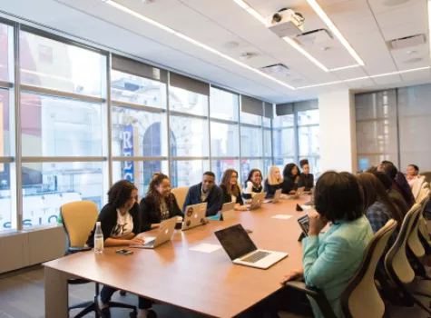 Group in Meeting - Office Setting - with Laptops