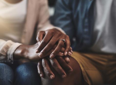 Close-up of Black Couple Holding Hands