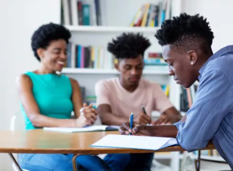 Black Students Doing Work at Desk