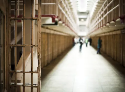 Long Prison Hallway with Illuminated Sillhouettes