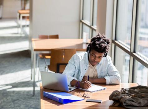 Young Black Student at Desk Working