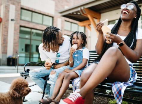 Young Black Family Outside Laughing