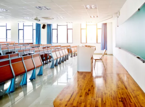 Unoccupied Classroom with Desks and Chairs in the Daytime