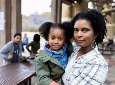 Black Female holding Toddler - Outdoors
