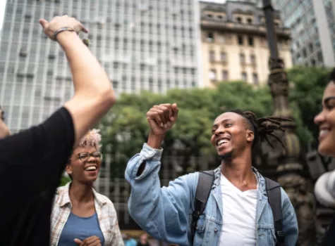 Group of Young People Having Fun and Dancing Together Outside