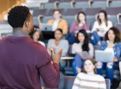 Black Man Teaching a Classroom of Students