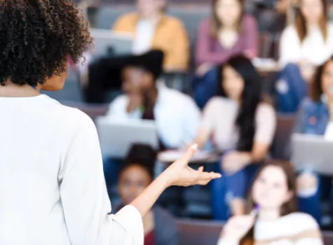 Blurred View of Teacher Instructing a Class of Students