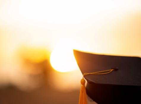 Up-Close Shot of Graduation Cap with Setting Sun