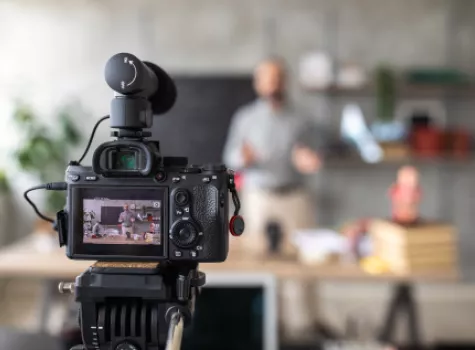 Close-up of Camera Filming a Scene Inside