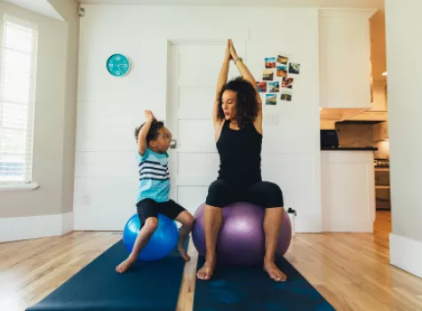 Mother and Child on Exercise Balls Inside Home