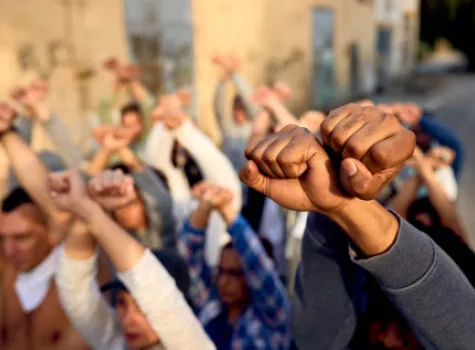 Group Holding Raised Fists in Protest