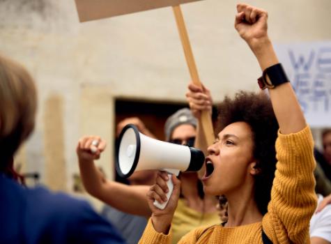 Black Female Protesting, Speaking into a Megaphone