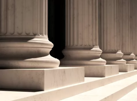 Outdoor View of Building Columns with Sun and Shadows