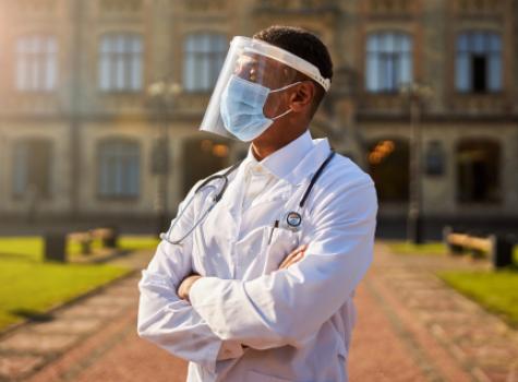 Black Doctor Wearing Mask and Face Shield - Outside
