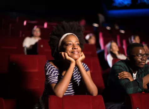 Group with Happy Expressions at the Movie Theater